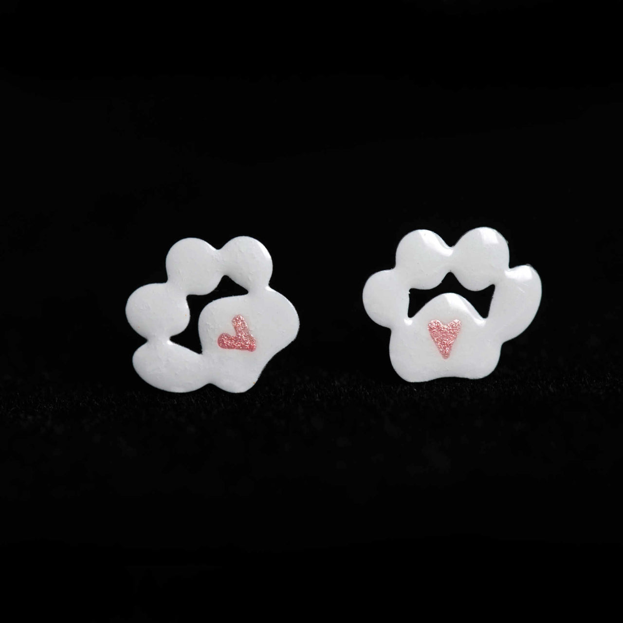 White paw earrings with a heart